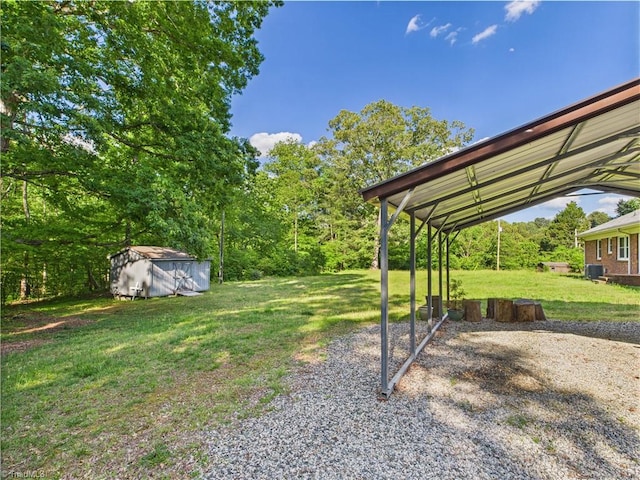 4208 Aberdare Dr, High Point, NC 27265 - view of green lawn featuring gravel driveway, a detached carport, and central air condition unit