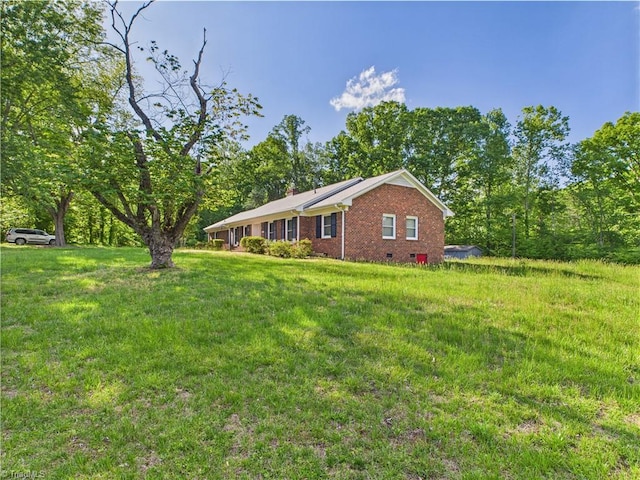 4208 Aberdare Dr, High Point, NC 27265 - view of home's exterior featuring brick siding and a yard