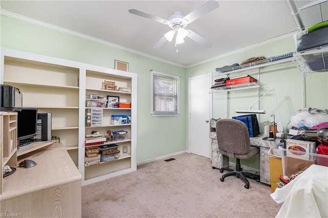 office space featuring ceiling fan, visible vents, ornamental molding, and carpet flooring