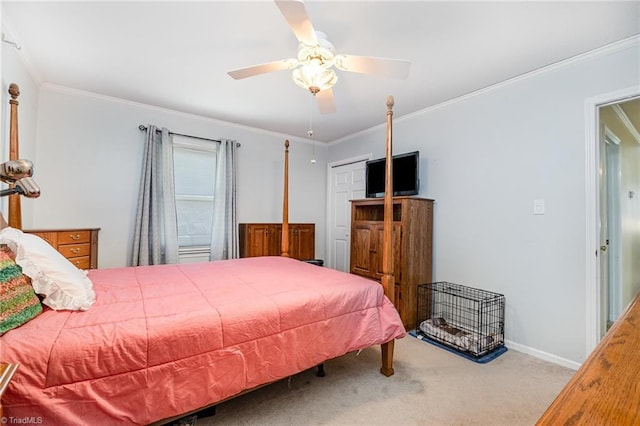 bedroom with ceiling fan, baseboards, crown molding, and carpet