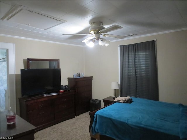 bedroom with ceiling fan, ornamental molding, and carpet floors