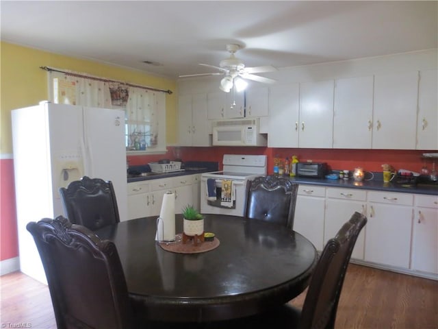 kitchen featuring white cabinetry, white appliances, ceiling fan, and dark hardwood / wood-style floors