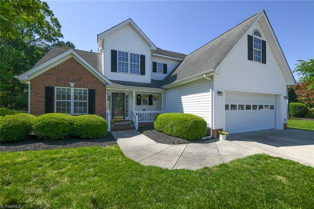 traditional-style house with a porch, brick siding, concrete driveway, a front lawn, and a shingled roof