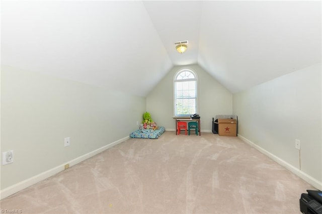 recreation room with carpet flooring, vaulted ceiling, and baseboards