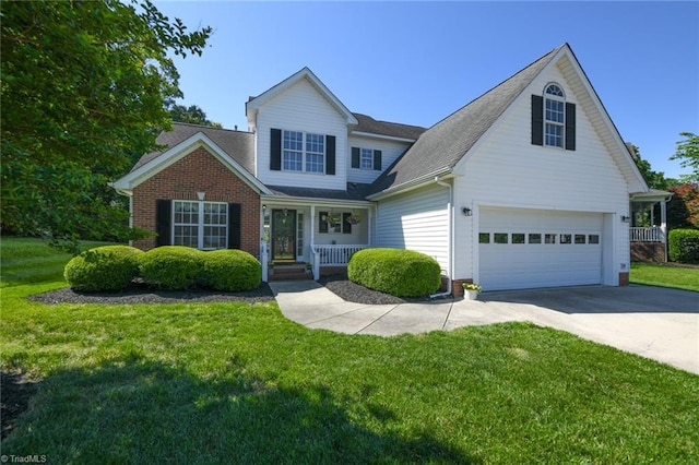 traditional home with covered porch, driveway, a front yard, and a shingled roof