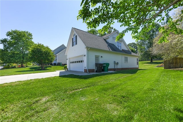 view of side of property featuring driveway, a lawn, and roof with shingles