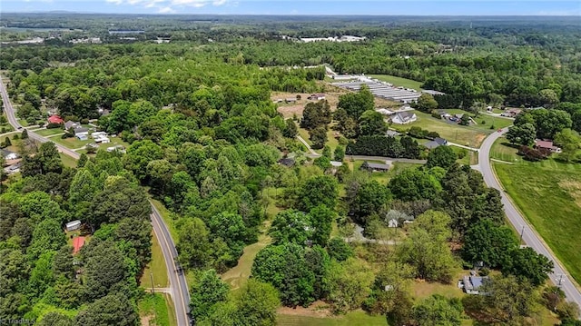 drone / aerial view with a view of trees