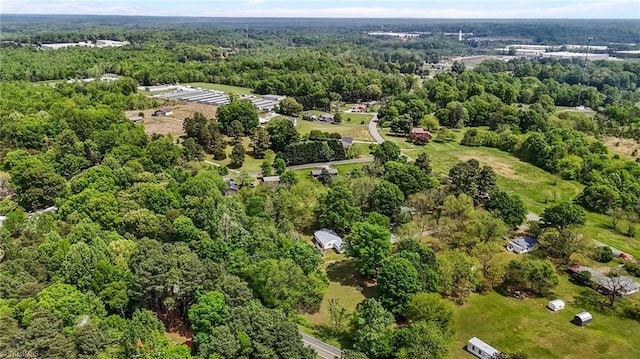 drone / aerial view featuring a forest view