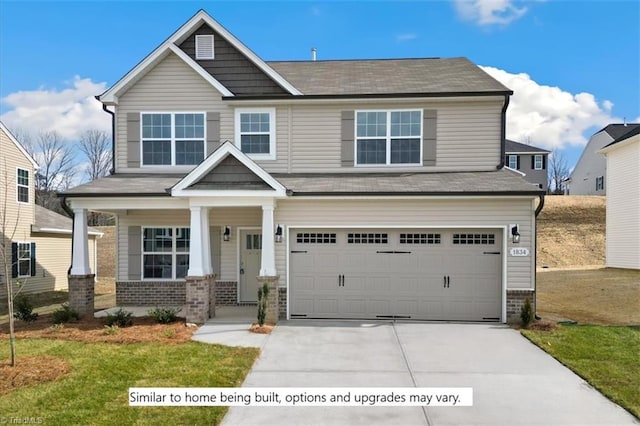 4095 Stallion St Lot 19, High Point, NC 27262 - craftsman house featuring brick siding, a garage, driveway, a porch, and a front yard