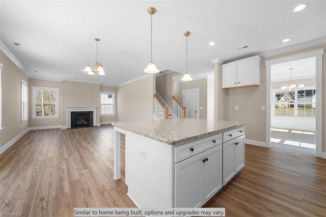 4095 Stallion St Lot 19, High Point, NC 27262 - kitchen featuring a chandelier, crown molding, baseboards, light wood-style floors, and recessed lighting