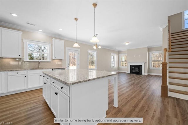 4095 Stallion St Lot 19, High Point, NC 27262 - kitchen featuring ornamental molding, light wood-style flooring, a center island, healthy amount of natural light, and recessed lighting
