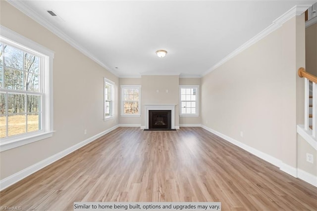 4095 Stallion St Lot 19, High Point, NC 27262 - unfurnished living room featuring plenty of natural light, light wood-type flooring, baseboards, and ornamental molding