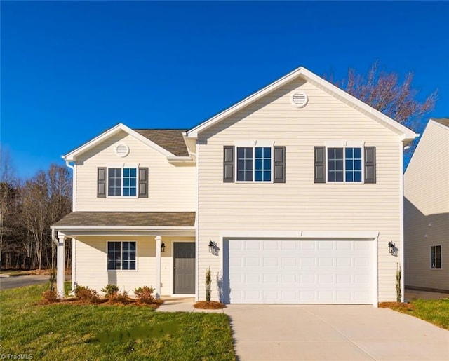 front facade featuring a garage, a front lawn, and covered porch