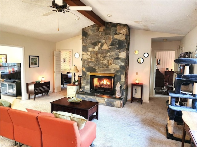 living room featuring a ceiling fan, light colored carpet, vaulted ceiling with beams, a textured ceiling, and a fireplace