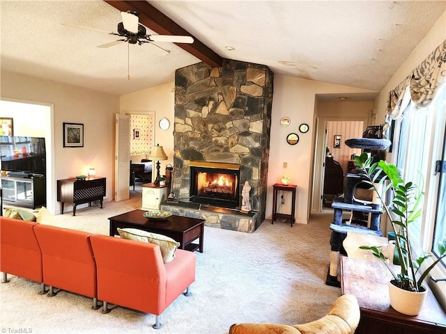 living room with vaulted ceiling with beams, a textured ceiling, a fireplace, and carpet