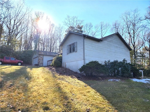 view of side of home featuring a yard