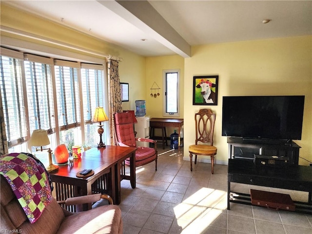 tiled living area with baseboards