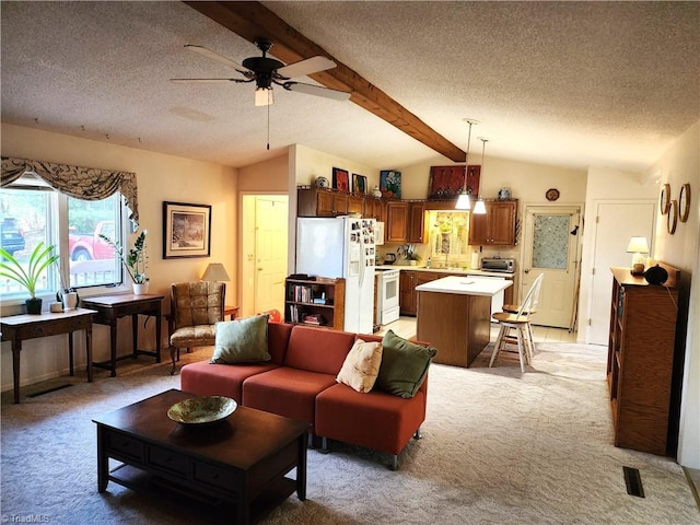 living room with vaulted ceiling with beams, visible vents, a ceiling fan, light carpet, and a textured ceiling