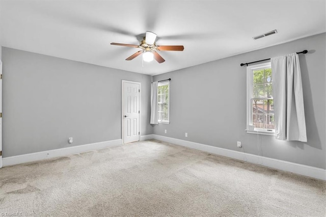 6 Yardarm Ct, Greensboro, NC 27455 - spare room with plenty of natural light, a ceiling fan, baseboards, and carpet floors