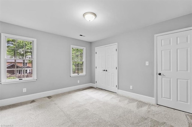 6 Yardarm Ct, Greensboro, NC 27455 - unfurnished bedroom featuring baseboards, carpet floors, and a closet