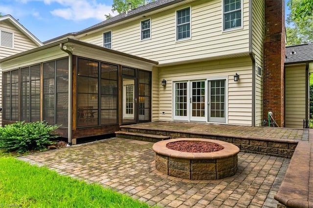6 Yardarm Ct, Greensboro, NC 27455 - rear view of property with a sunroom, a patio, and an outdoor fire pit