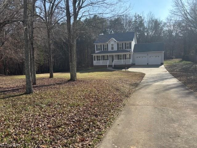 view of front of house featuring a porch and a garage