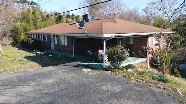 925 S Franklin Rd, Mount Airy, NC 27030 - exterior space featuring a chimney, driveway, an attached carport, brick siding, and a lawn
