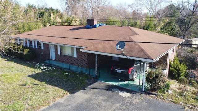 925 S Franklin Rd, Mount Airy, NC 27030 - view of front of property featuring a chimney, aphalt driveway, brick siding, a front lawn, and an attached carport