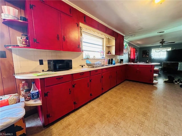 925 S Franklin Rd, Mount Airy, NC 27030 - kitchen featuring red cabinetry, light floors, open shelves, and black microwave