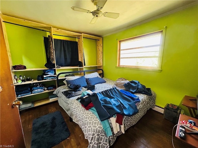925 S Franklin Rd, Mount Airy, NC 27030 - bedroom with ornamental molding, ceiling fan, a baseboard heating unit, and wood finished floors