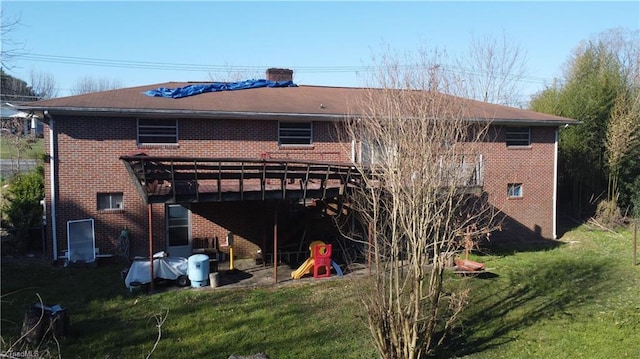 925 S Franklin Rd, Mount Airy, NC 27030 - rear view of house featuring a yard, brick siding, and a chimney