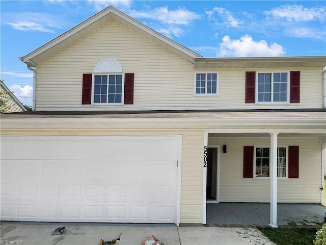 front of property with a garage