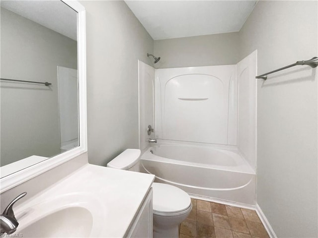 full bathroom featuring washtub / shower combination, tile patterned floors, toilet, and vanity