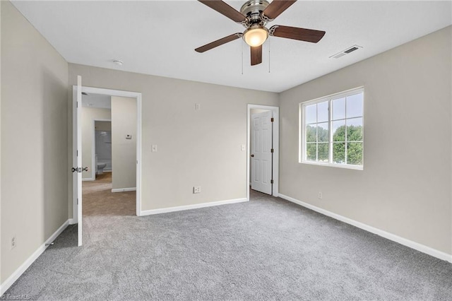 unfurnished bedroom featuring ceiling fan and carpet flooring