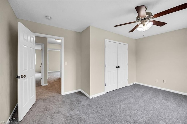 unfurnished bedroom featuring ceiling fan, carpet flooring, and a closet