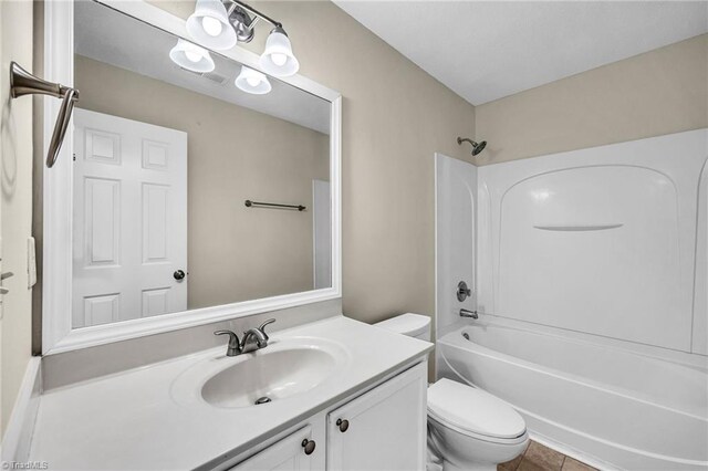 full bathroom with vanity, toilet, shower / bathing tub combination, and tile patterned flooring