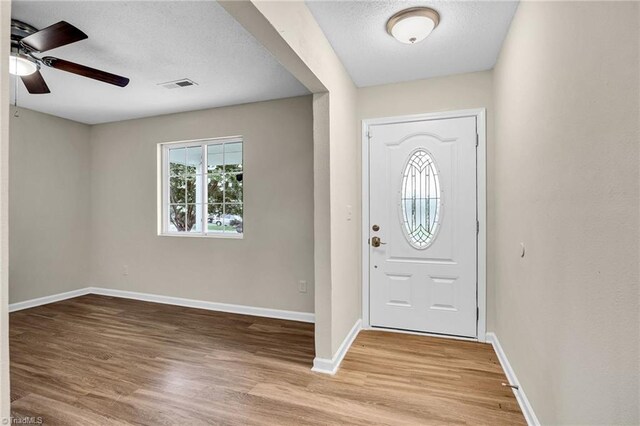 unfurnished dining area featuring an inviting chandelier and hardwood / wood-style flooring