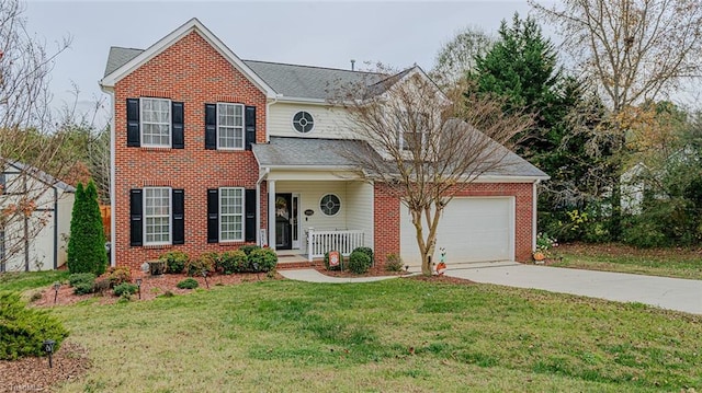 view of front of house with a porch, a garage, and a front lawn