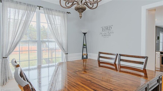 dining area featuring a chandelier