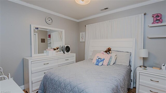 bedroom with ornamental molding