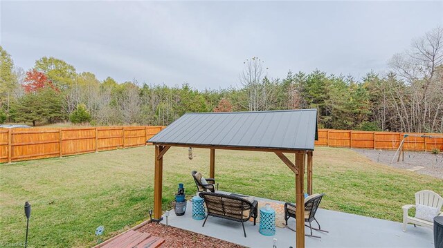 view of yard with outdoor lounge area, a gazebo, and a patio area