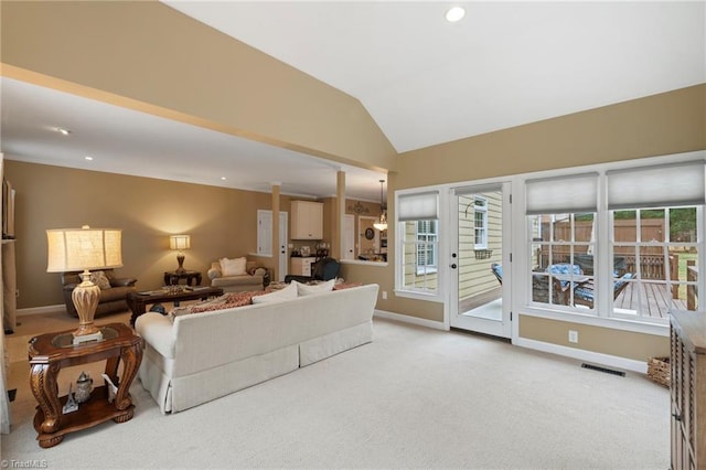 living room featuring light carpet and lofted ceiling