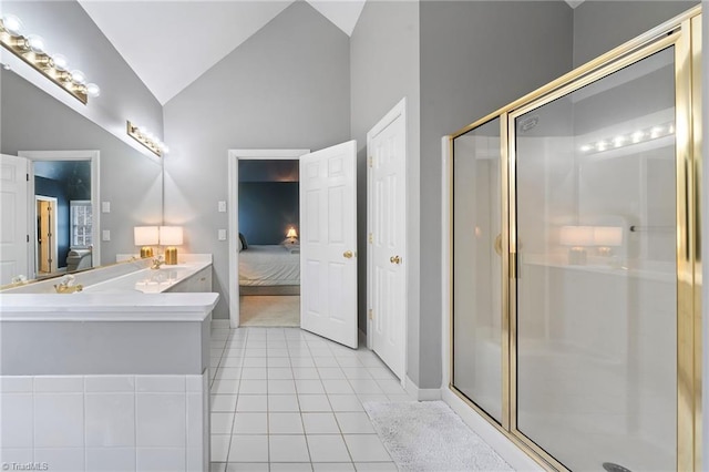 bathroom featuring tile patterned flooring, a shower with shower door, and vaulted ceiling