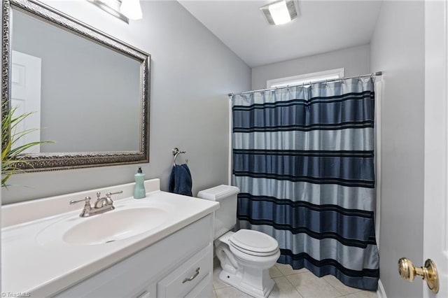 bathroom featuring vanity, toilet, walk in shower, and tile patterned floors