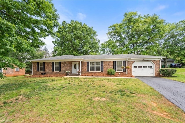 510 Hampton Dr, King, NC 27021 - ranch-style home with an attached garage, driveway, a front lawn, and brick siding