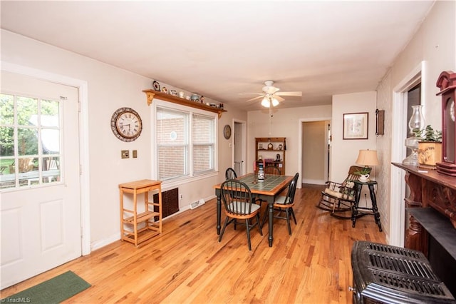 dining room featuring light hardwood / wood-style floors and ceiling fan