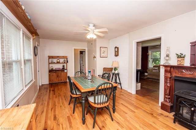 dining area featuring light hardwood / wood-style floors and ceiling fan