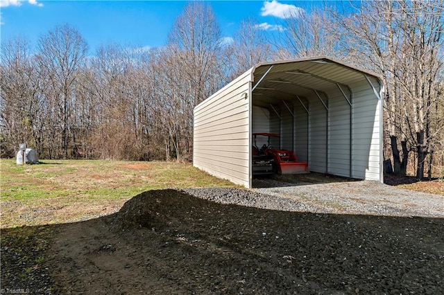 view of outdoor structure with a carport