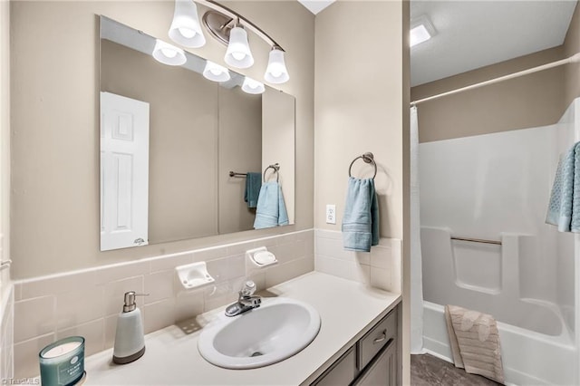 bathroom featuring vanity, shower / tub combo, and tasteful backsplash