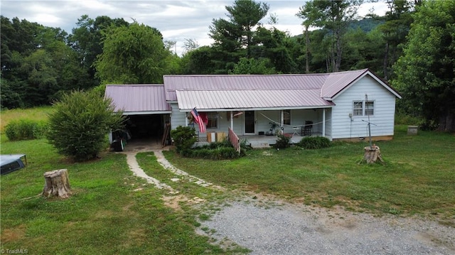 ranch-style house with a front yard and a porch